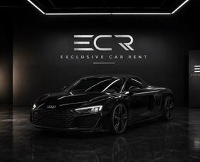 This 2024 Audi R8 Spyder is a two-seat convertible with a 5.2-litre V10 (465 kW, about 630 hp) and quattro all-wheel drive. It is black, the soft top folds away, and the engine makes one of the best ...