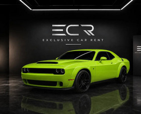 You will not miss this one in traffic. The 2023 Challenger GT comes in Sublime green with a 3.6-litre Pentastar V6 (227 kW, about 305 hp) and all-wheel drive, so it works in any season. The black lea...