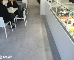 ULTRATOP LOFT cementinė dekoratyvinė grindų danga. "Ali šokoladinė" Kaune. 
http://www.velvemst.lt/uploads/Brochure_Ultratop_Loft_LT_web.pdf