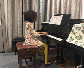 my student performing at a studio concert