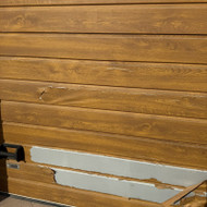 Segmentinių garažo vartų apdailos remontas arba pakeitimas