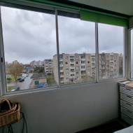 Daugiabučio balkono įstiklinimas